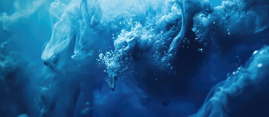 Fototapete - Dynamic blue ink swirling in dark water with bubbles creating an ethereal underwater atmosphere and abstract visual effects.