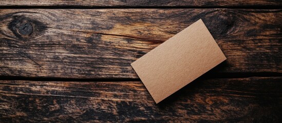 Poster - Business card placed on rustic wooden surface with ample copy space for branding and contact information.