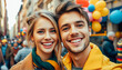 © Evgenii Starkov - Smiling young couple capturing a joyful moment with a selfie amidst a lively street festival decorated with balloons.