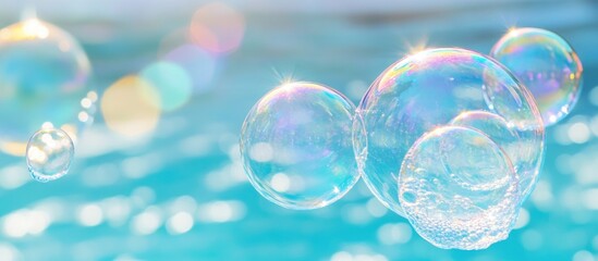 Leinwandbilder - Floating water bubbles with sparkling reflections against a shimmering blue background creating a serene and refreshing atmosphere.