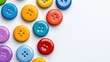 © Wiravan - Vibrant assortment of colorful buttons scattered on a clean white background evoking creativity and craft inspiration