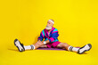 © deagreez - Full size photo poster of handsome granddad sportsman sit mat stretching wear trendy vintage sportswear isolated on yellow color background