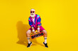 © deagreez - Full size photo poster of handsome granddad sportsman hold boom box dance wear vintage sportswear isolated on yellow color background