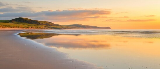Wall Mural - serene dawn at sandy beach with golden reflections and expansive space for text overlay