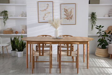 Wall Mural - Stylish wooden table with chairs and decor indoors. Interior design