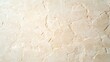 © Tanakrit - A smooth, light-colored stone surface with subtle texture and natural patterns, ideal for various design applications.