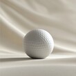 © B8stock - Close-up of a white golf ball on fabric.