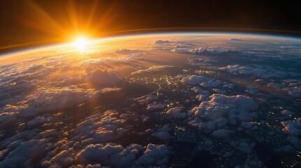 Fototapete - A breathtaking view of Earth from space, captured during what appears to be either dawn or dusk, with the sun casting a golden hue over the planet's surface and clouds below. The sun's rays pierce thr