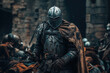 © Mediaphotos - Armored knight resting in midst of a chaotic medieval battlefield scene surrounded by other warriors, showcasing intense atmosphere and intricate armor details