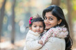 © Shivani - young indian mother carrying little daughter