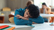 © Yuliia - Tired sleepy napping exhausted fatigued overworked overload pupil teen boy teenager sleep student guy teenage generation man male schoolboy health problem boring class lesson sleeping at table school