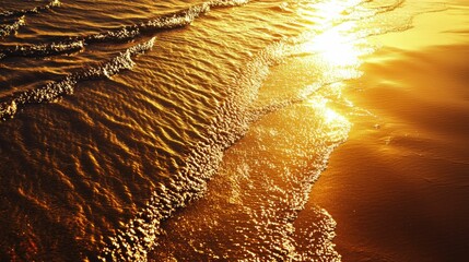 Wall Mural - Glimmering Ocean Waves at Sunset Reflecting Golden Light on Sand