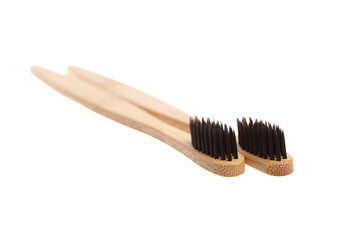 Wall Mural - Two eco-friendly bamboo toothbrushes with black bristles, placed parallel on a white background. Sustainable, biodegradable, and plastic-free alternative for oral care