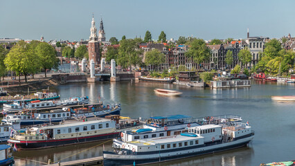 City panorama of Amsterdam aerial timelapse featuring the Montelbaanstoren tower. Netherlands