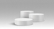 © RDVector - Three white cylindrical podiums with shadows on a transparent background. Stage showcase platforms vector.