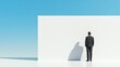 © Ronnakrit - Businessman Facing Large White Wall Under Blue Sky