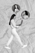 © deagreez - Vertical collage of positive girl walking use netbook communicate people isolated on crumpled pink background