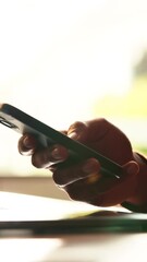 Person, hands and phone in home for contact, business and remote work with connectivity. Entrepreneur, mobile and typing in closeup for networking, online startup info and communication in message