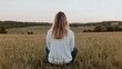© BROPRADANA - Woman meditating in field, sunset view, peaceful landscape, wellbeing