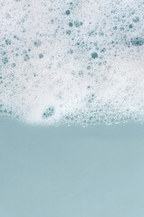 Wall Mural - Texture of white foam. Cleansing mousse for the face or bath foam or washing powder. Copy space