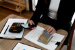 © sabthai - real estate agent woman is preparing documents and information