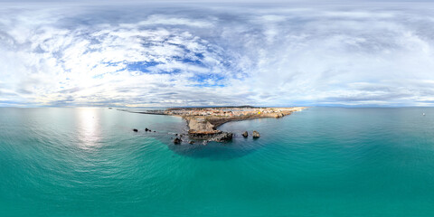 panoramic coastal view with turquoise waters of plage de la conque, france