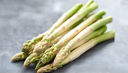 Wall Mural - Pile of fresh white asparagus on grey table, closeup