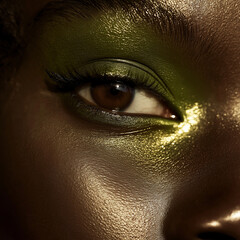 Wall Mural - woman eye makeup, green tones, dark skin model