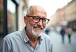 © Vadym - Happy senior man smiles outdoors. Elderly Caucasian man with glasses. He has pleasant expression. Closeup head shot. Outdoor urban setting. Man in casual shirt. Joyful, healthy. Retirement lifestyle.