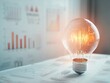 © jannoon028 - Light Bulb on Data Graphs Symbolizing Idea Generation with Financial Information Analysis