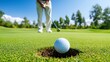 © Adama - Golfer putting ball into hole on green. (1)