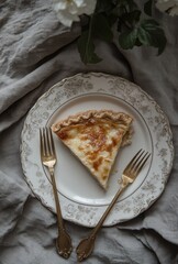 Wall Mural - Creamy Delicious Slice of Traditional Pie on Elegant Dish Surrounded by Soft Fabric and Vintage Cutlery with Natural Soft Lighting