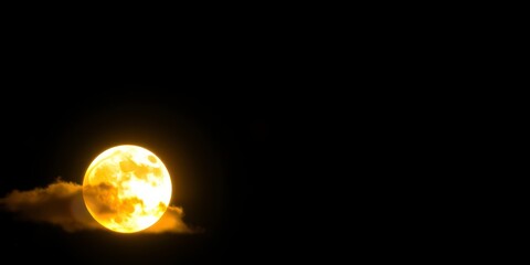 Wall Mural - A full moon partially obscured by clouds in a dark night sky