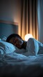 © Thanyaporn - Peaceful Sleep of Young Man in Cozy Bedroom at Nighttime