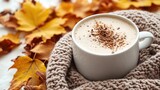Indulge in cozy autumn comfort at home! a warming cashmere plaid, a cup of hot cocoa, and maple foliage on a white isolated background has copyspace available for text or adverts.