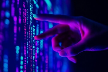 Hand interacts with digital code, dark background