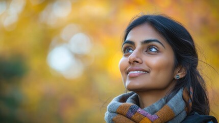 Wall Mural - A woman wears a scarf around her neck, adding a touch of elegance to her outfit