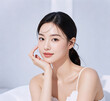© yanli - Beautiful Asian girl with cosmetics modeling clean face closeups