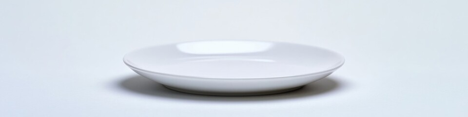 Wall Mural - A white ceramic bowl sits on a table