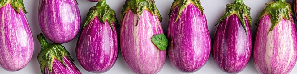 Sticker - A cluster of purple eggplants arranged closely, perfect for food or design use