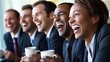 © Wittaya - A group of coworkers laughing together at a funny joke during a break in the office, with relaxed expressions and coffee cups in hand, representing the joy of lighthearted moments at work