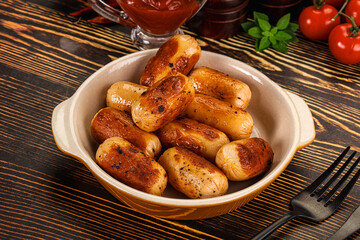 Wall Mural - Roasted chicken mini sausages for breakfast