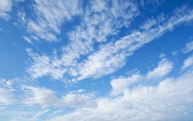 Wall Mural - beautiful blue sky with soft white clouds for abstract background