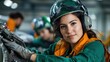 © tuiphotoengineer - Close up portrait of a young female aircraft engineer wearing a green uniform orange safety vest and a safety helmet while working on an aircraft in an industrial manufacturing setting