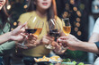 © Kritdanai - Cheers to Connection: A close-up shot of four hands holding glasses of wine, clinking together in a toast, highlighting the intimacy and celebration of friendship, connection, and shared moments.
