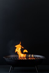Wall Mural - A black grill with a fire on it. The fire is orange and yellow