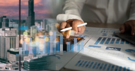 Wall Mural - man is using a calculator budgeting and tax calculation budget management