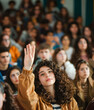 © Nadezda Ledyaeva - active female student raises her hand to answer a question during meeting at institute