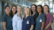 © Elena - A team of female doctors and nurses smiling together, symbolizing empowerment, dedication, and equality in healthcare