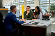© DusanJelicic - Enthusiastic young couple discussing car purchase options with a professional salesman at a modern dealership. Bright showroom environment with a sleek vehicle in the background